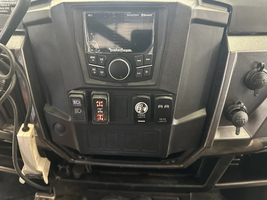 Lavigne's Car Audio installed a head unit and switch panel in a UTV dash in North Bay, Ontario